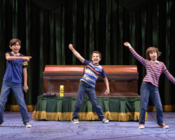 The Bechdel children (l to r: Dylan Kento Curtis, Oliver Copaken Yellin, and Ruth Keith) fantasize a commercial for their family-owned funeral home in “Fun Home,” presented by TheatreWorks Silicon Valley October 1-28 at the Mountain View Center for the Performing Arts.
NOTE: These children appear in performances on October 2, 4, 7 (2pm), 10, 13 (2pm), 14 (7pm), 16, 18, 20 (2pm), 21 (7pm), 24 (2pm), 10/25 (8pm), 28 (2pm).