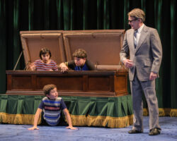 The Bechdel children (clockwise from left: Lila Gold, Jack Barrett, and Billy Hutton) play in the family-owned funeral home despite their father Bruce’s (James Lloyd Reynolds) wishes in “Fun Home,” presented by TheatreWorks Silicon Valley October 1-28 at the Mountain View Center for the Performing Arts.
NOTE: These children appear in performances on October 3, 5, 6, 7 (7pm), 9, 11, 12, 13 (8pm), 14 (2pm), 17, 19, 20 (8pm), 21 (2pm), 24 (7:30pm), 25 (2pm), 26, 27.