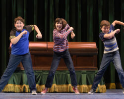The Bechdel children (l to r: Jack Barrett, Lila Gold, and Billy Hutton) fantasize a commercial for their family-owned funeral home in “Fun Home,” presented by TheatreWorks Silicon Valley October 1-28 at the Mountain View Center for the Performing Arts.
NOTE: These children appear in performances on October 3, 5, 6, 7 (7pm), 9, 11, 12, 13 (8pm), 14 (2pm), 17, 19, 20 (8pm), 21 (2pm), 24 (7:30pm), 25 (2pm), 26, 27.