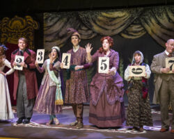 Cast members (l to r: Brenna Sammon, Zach Goller, Rachelle Abbey, David Murphy, Heather Orth, Linda Piccone, and Benjamin Ball) urge audience members to vote on the ending of "The Mystery of Edwin Drood," presented by Foothill Music Theatre February 27 - March 8 at the Lohman Theatre in Los Altos Hills.