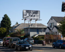<strong>Pictured: "I made you in my image" by Chloë Bass on display at 6315 Shattuck Ave, Oakland. The image is an "excerpt" of a family photograph found in the New York Public Library's Media Collection that asks viewers to consider the relationship between people and cities as familial.</strong><br>
Montalvo Arts Center will present original artworks around the Bay Area with its newly launched public exhibition, "lone some," now through July 31.