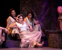 L-R: Mercédès (Stephanie Sanchez), Carmen (Nikola Printz), and Frasquita (Teresa Castillo) lounge outside the cigarette factory in Opera San José's "Carmen" at the California Theatre, Feb. 12-27, 2022.