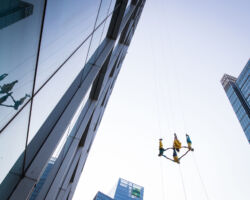 Vertical dance innovators BANDALOOP will open its newly expanded headquarters, BANDALOOP Studios, in West Oakland with a free community event, November 12. Seen here: BANDALOOP performing in Shanghai, China.