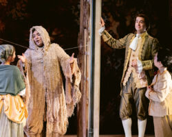 Le Comte Ory (Minghao Liu, left) disguises himself as a hermit aided by his friend Raimbaud (Benjamin Dickerson, right), in Merola Opera Program’s "Le Comte Ory," Jul. 31 & Aug. 2, 2025, at the San Francisco Conservatory of Music’s Caroline H. Hume Concert Hall.