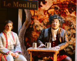 Le Comte Ory’s page Isolier (Meg Brilleslyper, left) and the Gouverneur (Wanchun Liang, right) grow suspicious of the hermit upon learning he arrived in the village shortly after Ory disappeared in Merola Opera Program’s "Le Comte Ory," Jul. 31 & Aug. 2, 2025, at the San Francisco Conservatory of Music’s Caroline H. Hume Concert Hall.