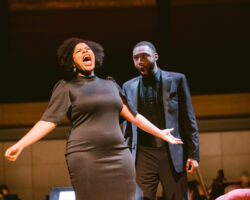 Baritone Justice Yates (right), as Enrico, discovers a locket belonging to mezzo-soprano Charlotte Siegel’s (left) Anna Bolena and uses it as evidence of her infidelity in Donizetti’s "Anna Bolena," featured in Merola Opera Program’s Schwabacher Summer Concert: "It’s Complicated – Love & Opera," July 10 and 12, 2025, at the San Francisco Conservatory of Music’s Caroline H. Hume Concert Hall.
