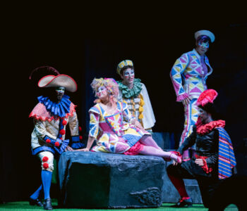 (l to r) Bass John Mburu as Truffaldino, soprano Emilie Kealani as Zerbinetta, tenor Cole McIlquham as Brighella, baritone Paul Jang as Harlequin, and tenor Logan Wagner as Scaramuccio in Merola Opera Program's "Ariadne auf Naxos," performing Thursday, July 30 and Saturday, August 1 at the San Francisco Conservatory of Music’s Caroline H. Hume Concert Hall.
